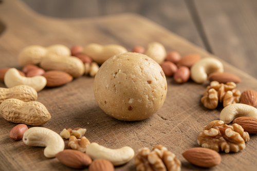 Protein Ball on Wooden Board with Nuts
